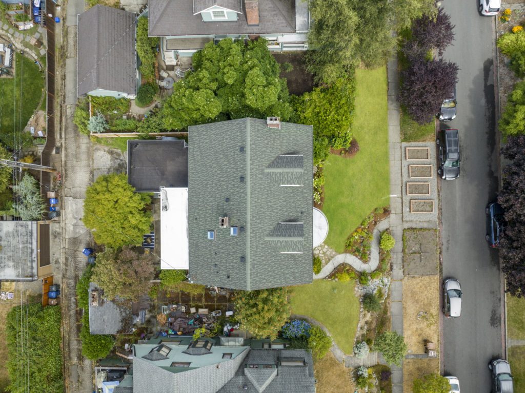 Aerial Real Estate Photography of a house in a neighborhood.